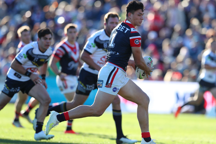 JOSEPH MANU of the Sydney Roosters runs the ball during the NRL match between the Sydney Roosters and the North Queensland Cowboys at Central Coast Stadium in Gosford, Australia.