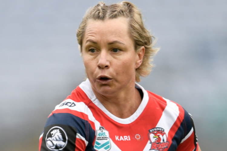 KYLIE HILDER of the Roosters runs the ball during the Women's NRL match between the Sydney Roosters and the New Zealand Warriors at ANZ Stadium in Sydney, Australia.