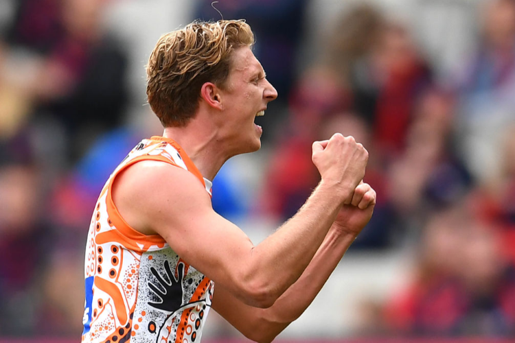 LACHIE WHITFIELD of the Giants celebrates kicking a goal during the AFL match between the Melbourne Demons and the Greater Western Sydney Giants at Melbourne Ground, Australia.