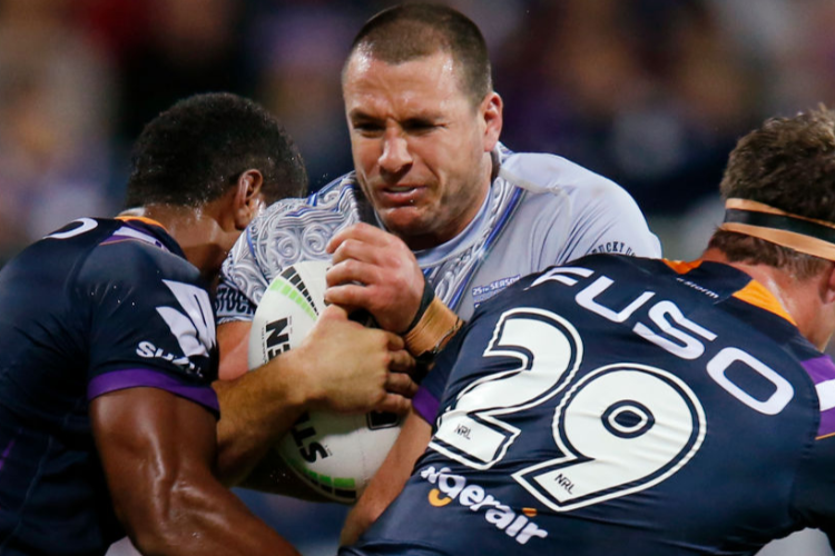 LACHLAN BURR of the Warriors is tackled during the NRL Trial Match between the Melbourne Storm and the New Zealand Warriors at GMHBA Stadium in Geelong, Australia.