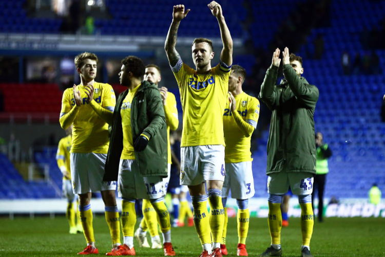 Leeds Captain LIAM COOPER celebrates with his team after winning the Sky Bet Championship match between Reading and Leeds United at the Madejski Stadium in Reading, England.