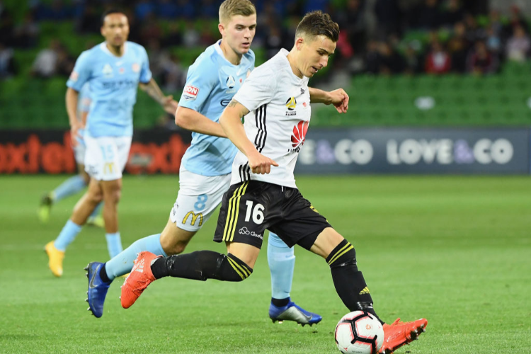 LOUIS FENTON of the Phoenix passes the ball during the A-League match between Melbourne City and the Wellington Phoenix at AAMI Park in Melbourne, Australia.