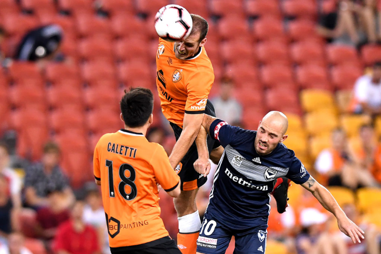LUKE DEVERE of the Roar heads the ball during the A-League match between the Brisbane Roar and the Melbourne Victory at Suncorp Stadium in Brisbane, Australia.