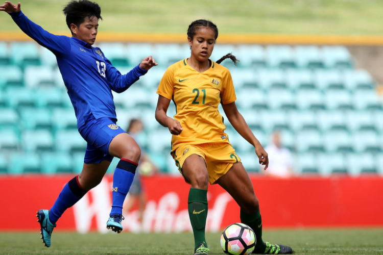 PANITTHA JEERANTANAPAVAVIBUL of Thailand and MARY FOWLER of Australia compete for the ball during the International match between the Young Matildas and Thailand at Leichhardt Oval in Sydney, Australia.