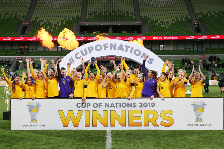Sam Kerr of the MATILDAS lifts up the trophy and celebrates the win with teammates during the Cup of Nations match between Australia and Argentina at AAMI Park in Melbourne, Australia.