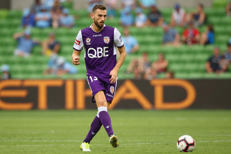 MATTHEW SPIRANOVIC of the Glory passes the ball during the A-League match between Melbourne City and the Perth Glory at AAMI Park in Melbourne, Australia.