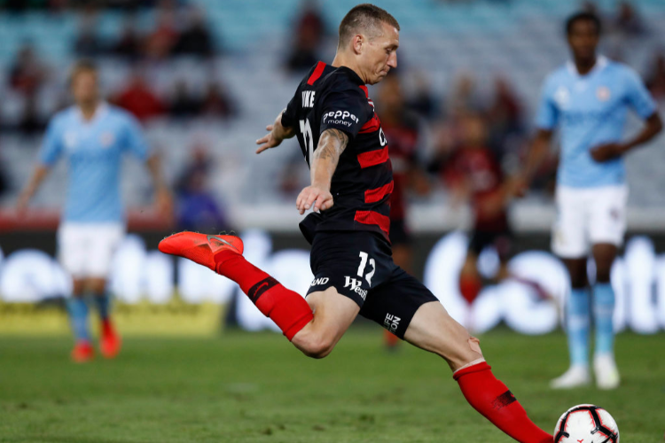 MITCHELL DUKE of the Wanderers kicks during the A-League match between the Western Sydney Wanderers and Melbourne City at ANZ Stadium in Sydney, Australia.