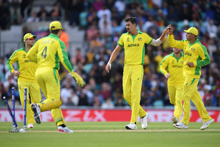 MITCHELL STARC of Australia celebrates with team mates during the ICC Cricket World Cup between Sri Lanka and Australia at The Oval in London, England.