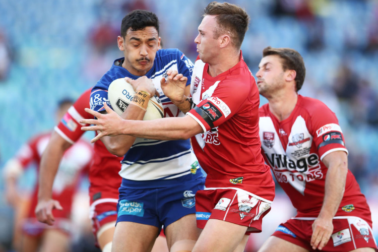 MORGAN HARPER of the Bulldogs is tackled during the 2018 NRL Intrust Super State Championship between the Canterbury-Bankstown Bulldogs and the Redcliffe Dolphins at ANZ Stadium in Sydney, Australia. MORGAN HARPER of the Bulldogs is tackled during the 2018 NRL Intrust Super State Championship between the Canterbury-Bankstown Bulldogs and the Redcliffe Dolphins at ANZ Stadium in Sydney, Australia.