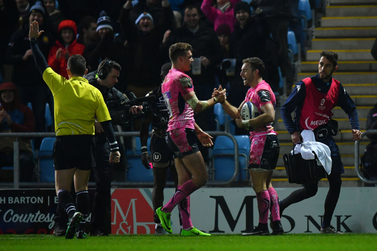 NIC WHITE of Exeter Chiefs (r) celebrates after scoring his side's fourth try during the European Rugby Champions Cup match between Exeter Chiefs and Montpellier at Sandy Park in Exeter, England.