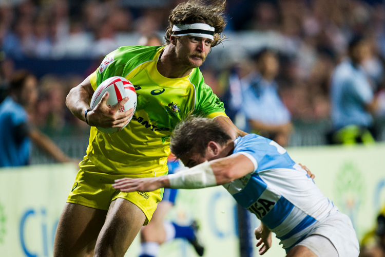 NICK CUMMINS of Australia competes during the Hong Kong Sevens match between Australia and Argentina at Hong Kong Stadium in Hong Kong. NICK CUMMINS of Australia competes during the Hong Kong Sevens match between Australia and Argentina at Hong Kong Stadium in Hong Kong.