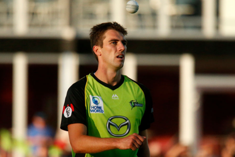 PAT CUMMINS of the Thunder prepares to bowl during the Big Bash League match between the Sydney Thunder and the Hobart Hurricanes at Manuka Oval in Canberra, Australia.