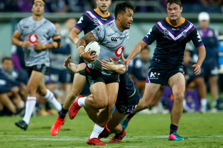 PATRICK HERBERT of the Warriors breaks a tackle during the NRL Trial Match between the Melbourne Storm and the New Zealand Warriors at GMHBA Stadium in Geelong, Australia.
