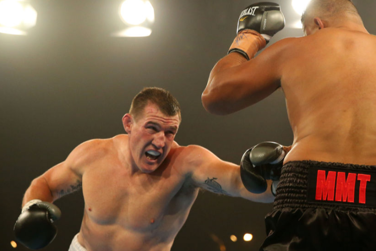 PAUL GALLEN punches JOHN HOPOATE during the Star of the Ring III Charity Fight Night at Hordern Pavilion in Sydney, Australia.