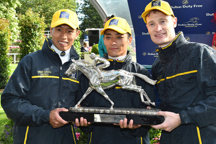 The Rest of the World team riders celebrate their Shergar Cup victory - Vincent Ho (left), Yuga Kawada and Mark Zahra .