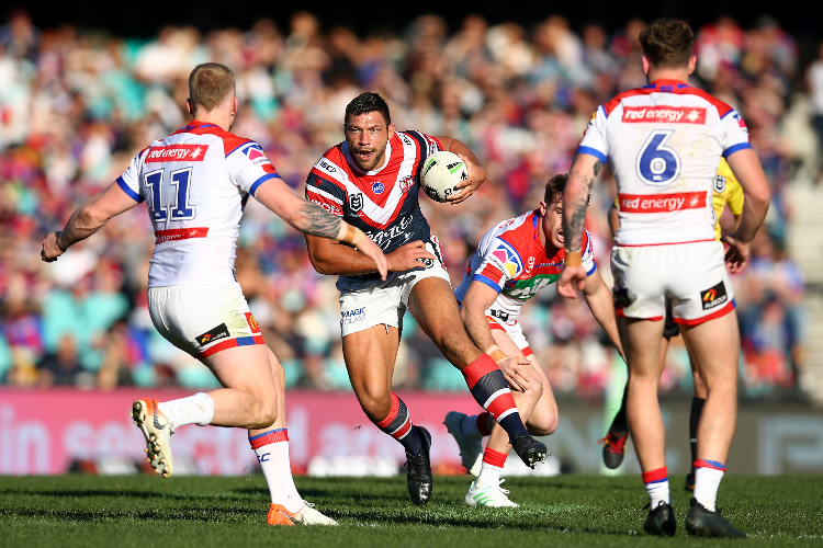 RYAN HALL of the Roosters runs the ball during the NRL match between the Sydney Roosters and the Newcastle Knights in Sydney, Australia.