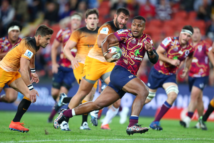 SAMU KEREVI of the Reds makes a break during the Super Rugby match between the Reds and the Jaguares at Suncorp Stadium in Brisbane, Australia.