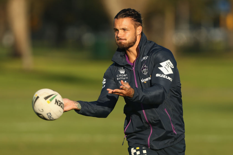 SANDOR EARL offloads the ball during a Melbourne Storm NRL media opportunity at Gosch's Paddock in Melbourne, Australia.