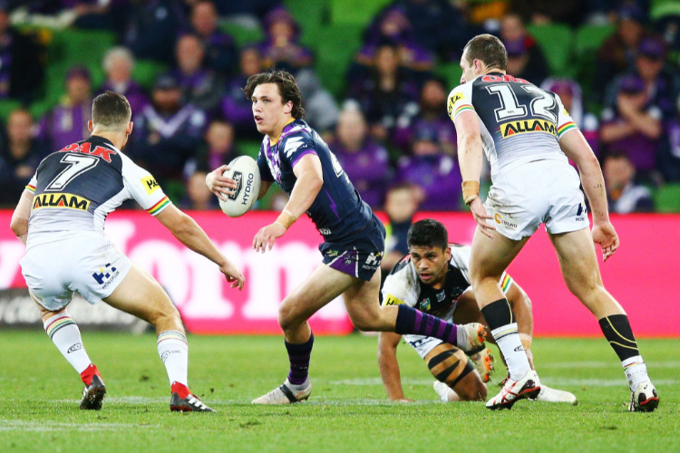 SCOTT DRINKWATER of the Storm runs with the ball during the NRL match between the Melbourne Storm and the Penrith Panthers at AAMI Park in Melbourne, Australia.