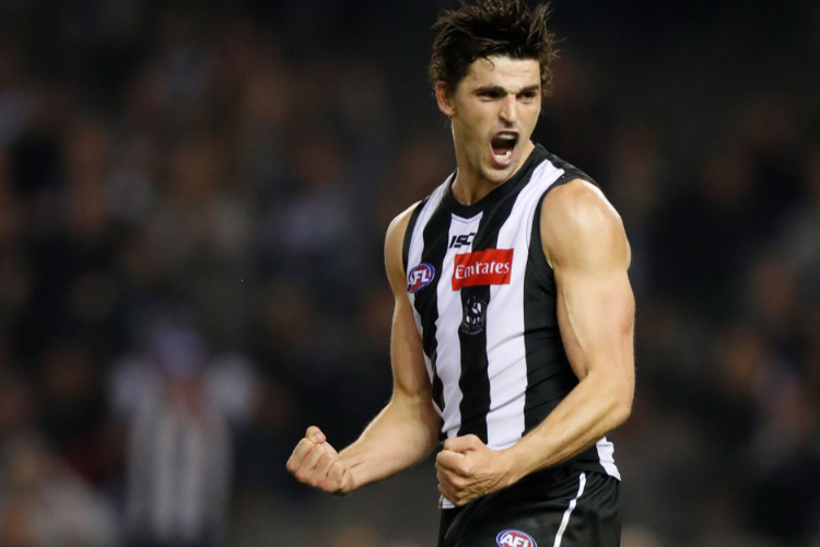 SCOTT PENDLEBURY of the Magpies celebrates during the AFL match between the Collingwood Magpies and the Western Bulldogs at Etihad Stadium in Melbourne, Australia.