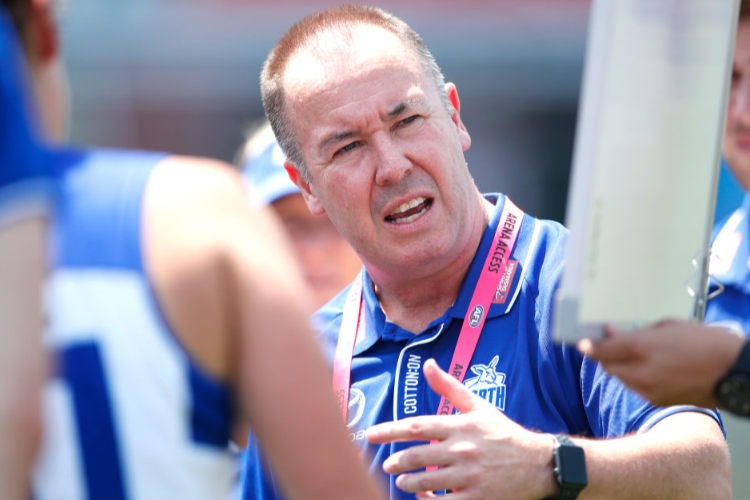 SCOTT GOWANS, Senior Coach of the Kangaroos addresses his players during the NAB AFLW match between the North Melbourne Tasmanian Kangaroos and the Carlton Blues at North Hobart Oval in Hobart, Australia.