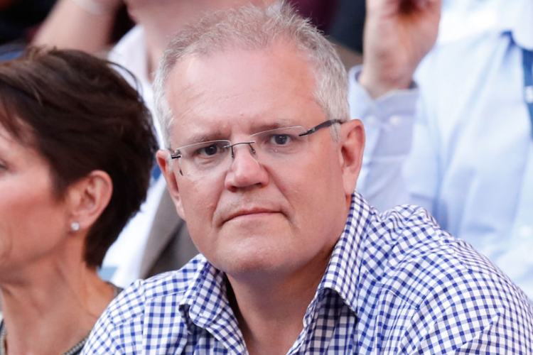 Prime Minister of Australia SCOTT MORRISON watches the match between Roger Federer of Switzerland and Stefanos Tsitsipas of Greece during the Australian Open at Melbourne Park in Melbourne, Australia.