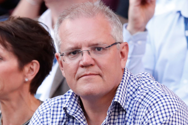 Prime Minister of Australia SCOTT MORRISON watches the match between Roger Federer of Switzerland and Stefanos Tsitsipas of Greece during day seven of the 2019 Australian Open at Melbourne Park in Melbourne, Australia. Prime Minister of Australia SCOTT MORRISON watches the match between Roger Federer of Switzerland and Stefanos Tsitsipas of Greece during day seven of the 2019 Australian Open at Melbourne Park in Melbourne, Australia.
