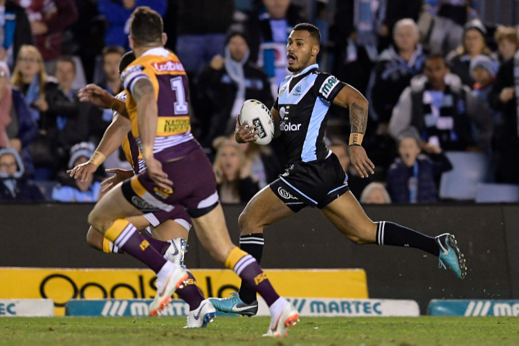 SIONE KATOA of the Sharks makes a break during the NRL match at Southern Cross Group Stadium in Sydney, Australia.