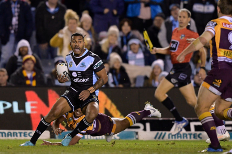 SIONE KATOA of the Sharks makes a break during the NRL match between the Cronulla Sharks and the Brisbane Broncos at Southern Cross Group Stadium in Sydney, Australia. SIONE KATOA of the Sharks makes a break during the NRL match between the Cronulla Sharks and the Brisbane Broncos at Southern Cross Group Stadium in Sydney, Australia.