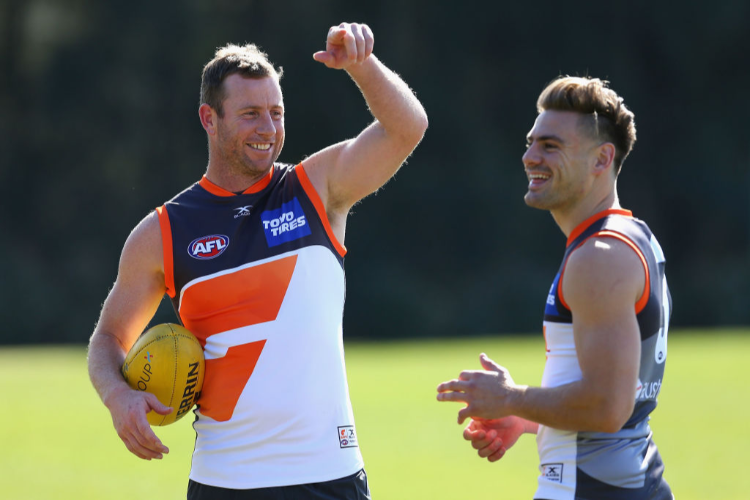 STEVE JOHNSON of the Giants speaks to STEPHEN CONIGLIO of the Giants during a Greater Western Sydney Giants AFL training session at Sydney Olympic Park in Sydney, Australia.