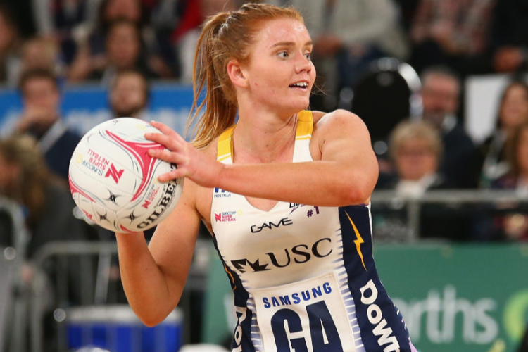STEPH WOOD of the Lightning passes the ball during the Super Netball match between the Vixens and the Lightning at Hisense Arena in Melbourne, Australia.