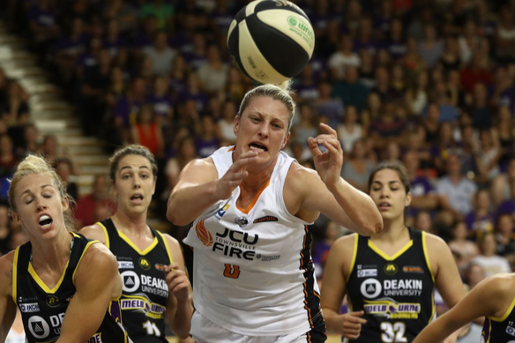 SUZY BATKOVIC of the Townsville Fire looses the ball during game two of the WNBL Grand Final series between the Melbourne Boomers and the Townsville Fire at the State Basketball Centre in Melbourne, Australia.