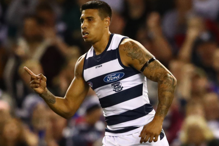 TIM KELLY of the Cats celebrates after kicking a goal during the AFL match between the Western Bulldogs and the Geelong Cats at Marvel Stadium in Melbourne, Australia.