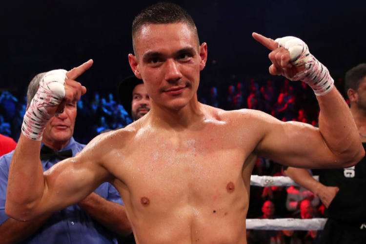 TIM TSZYU celebrates winning his Australian super welterweight title bout against Joe Camilleri at The Star in Sydney, Australia.