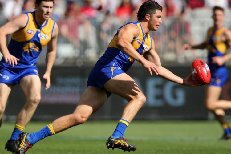 TOM BARRASS of the Eagles runs onto the ball during the AFL Preliminary Final match between the West Coast Eagles and the Melbourne Demons in Perth, Australia.