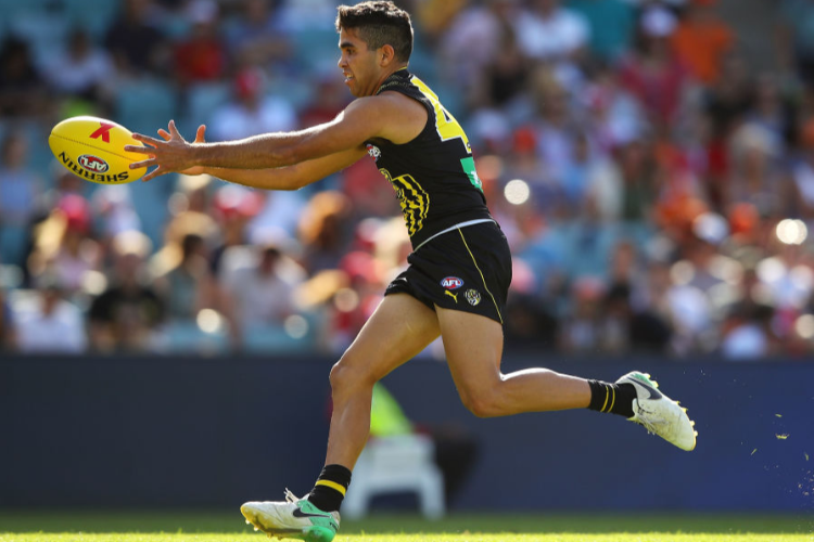 TYSON STENGLE of the Tigers runs with the ball during the AFLX match between the Richmond Tigers and the Brisbane Lions at Allianz Stadium in Sydney, Australia.