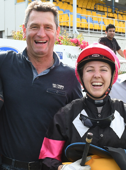 Robbie Patterson and jockey Samantha Collett are all smiles after the pair recorded a treble at New Plymouth on Thursday.