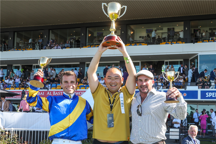Triumphant co-owner Alan Fu celebrates the win of Dragon Storm with rider Craig Grylls (left) and trainer Chris Gibbs