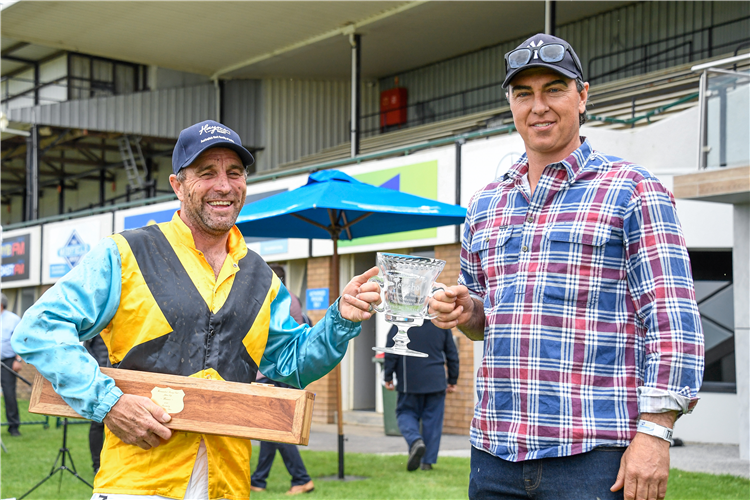 Jockey Luke Williams and trainer Symon Wilde are all smiles at the presentation of trophies for the A$300,000 Haymes Paint Jericho Cup (4600m)
