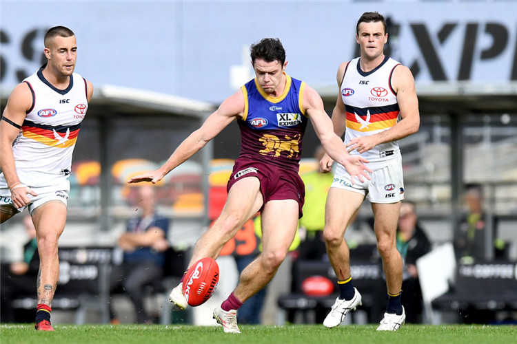 LACHIE NEALE of the Lions kicks the ball during the AFL match between the Brisbane Lions and the Adelaide Crows at The Gabba in Brisbane, Australia.