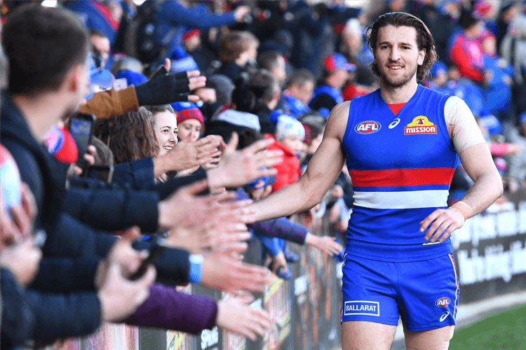 MARCUS BONTEMPELLI of the Bulldogs high fives fans after winning the AFL match between the Western Bulldogs and the Adelaide Crows at Mars Stadium in Ballarat, Australia.