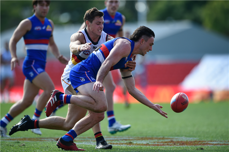 TOBY MCLEAN of the Bulldogs competes for the ball during the AFL match between the Western Bulldogs and the Adelaide Crows at Metricon Stadium in Gold Coast, Australia.