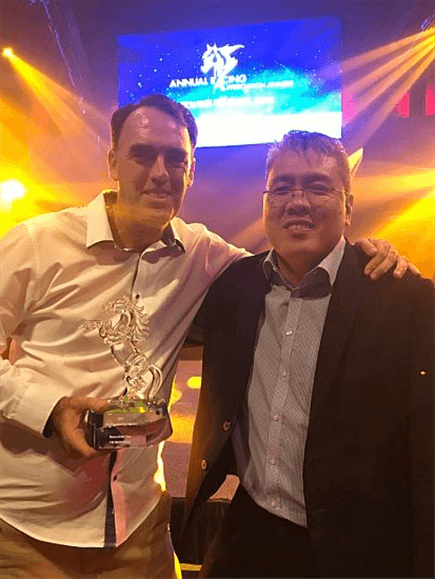 Trainer Shane Baertschiger and owner Desmond Ong of Doha Stable celebrate I'm Incredible's Singapore Horse Of The Year award.