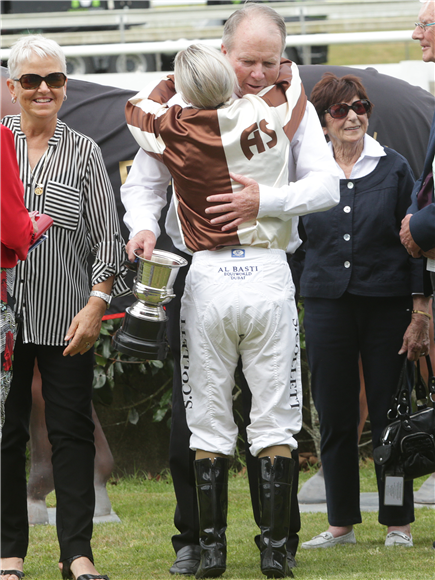 Philip Brown gives jockey Samantha Collett a hug after she guided Levante to a stunning victory in the Listed Haunui Farm Counties Bowl (1100m) at Pukekohe