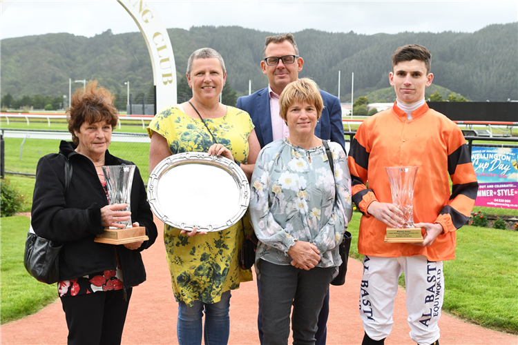 Rydges Wellington representative Jeff Hermes watches as trainer Leanne Elliot (2nd from right) celebrates with her mum Jill Ker (left), sister Yvonne and son Ryan after Rock On Wood’s win at Trentham