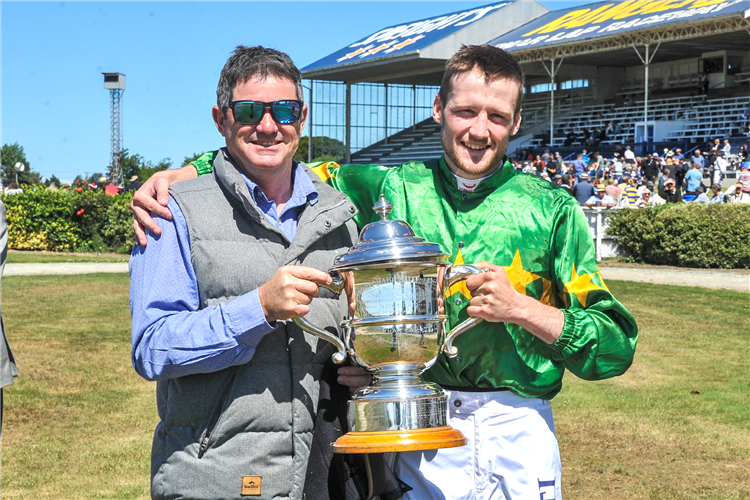 Shane Anderton and Jacob Lowry pose with the Timaru Cup trophy at the Phar Lap raceway