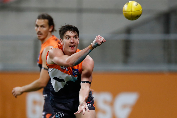 SAM TAYLOR of the Giants handballs during the AFL match between Greater Western Sydney Giants and Collingwood Magpies at GIANTS Stadium, Australia.