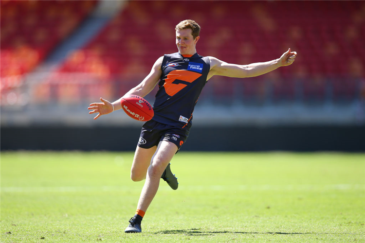 TOM GREEN of the Giants kicks during a Greater Western Sydney Giants AFL training session at GIANTS Stadium in Sydney, Australia.