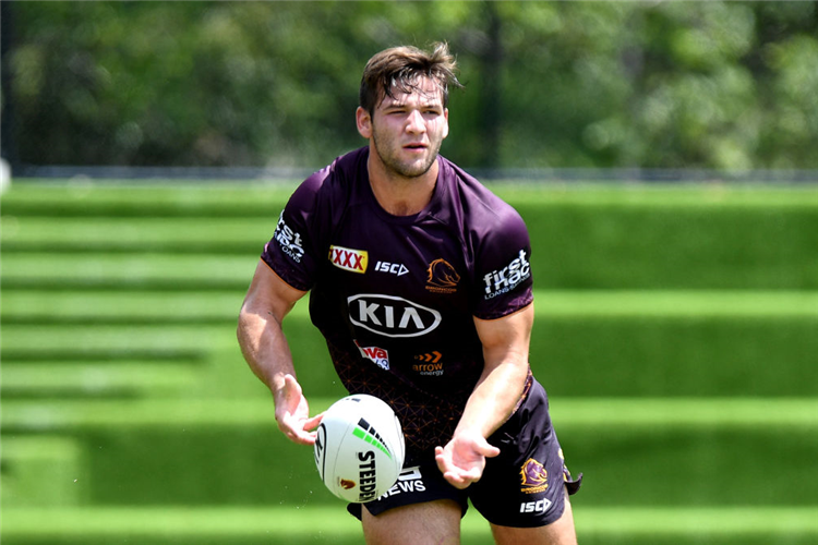 PATRICK CARRIGAN passes the ball during a Brisbane Broncos NRL training session at Red Hill in Brisbane, Australia.