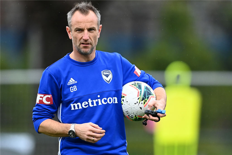 Victory interim Head Coach, GRANT BREBNER gives instructions during a Melbourne Victory A-League training session at Gosch's Paddock in Melbourne, Australia.